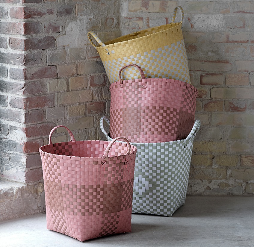 THERMAN baskets in brown, grey, white and yellow Four baskets in different colours stacked