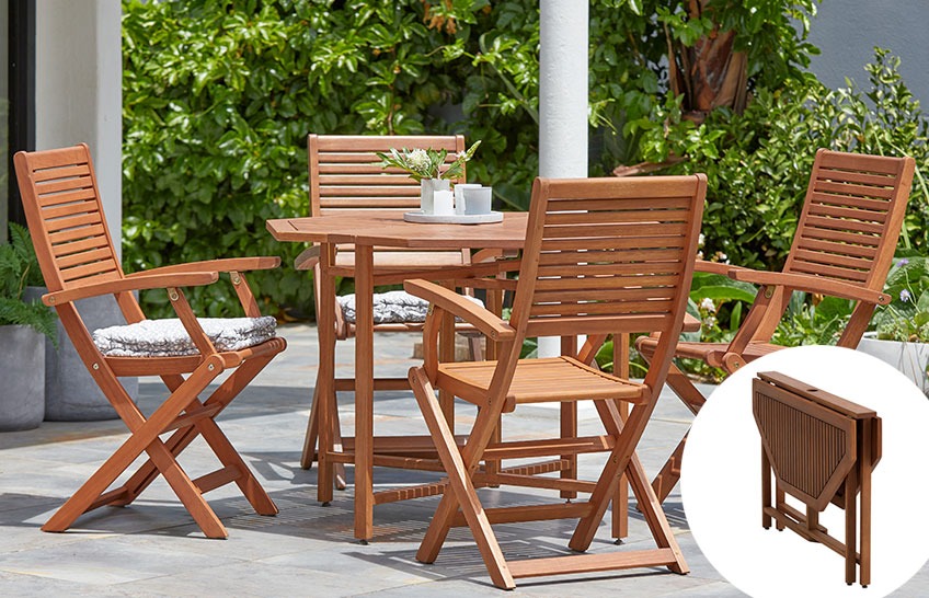 Garden set with wooden garden table and 4 wooden garden chairs on a patio