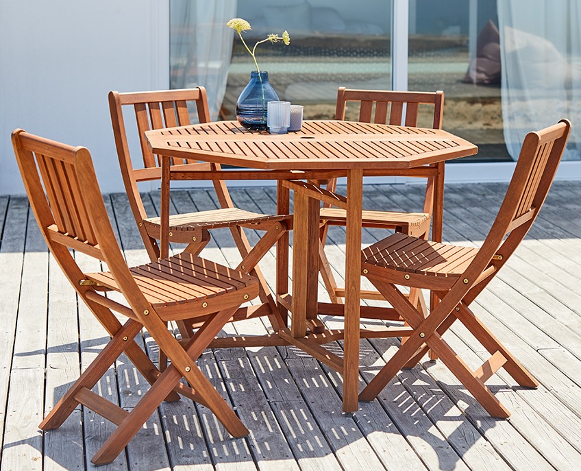 Wooden garden set with table and 4 chairs on a wooden patio 