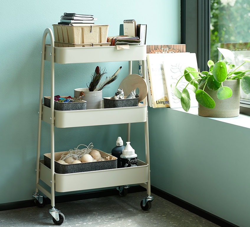 KANSTRUP trolley with BJORK storage boxes and GRIMUR baskets Sand coloured trolley with storage boxes and felt baskets by a window